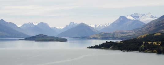 Lake Wakatipu just outside of Queenstown, New Zealand, with snowcapped mountains just beyond the far shore