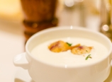 Goat cheese and apple soup with grape tempura
