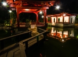Gazebo seats and pond at night