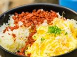 Scrambled eggs, cheese, hashbrowns, and veggie bacon bits