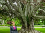 Ann Van Heest by the purple tree